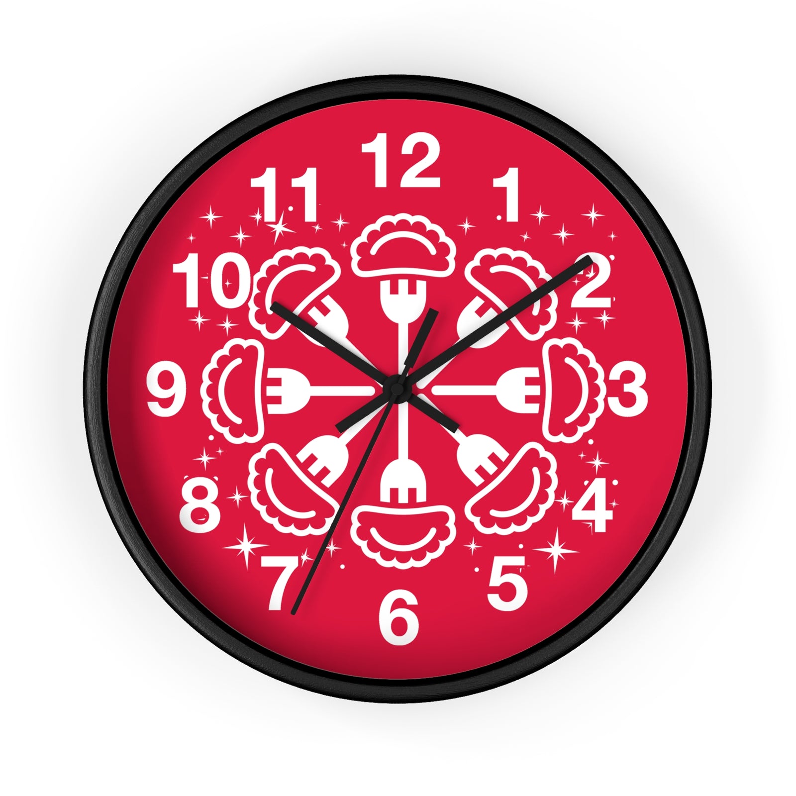 The Pierogi Snowflake Wall Clock features a black base with white numbers and hands. Its face displays a circular snowflake pattern of white pierogi and forks, accented by small stars—a festive, unique gift or playful kitchen decor piece.