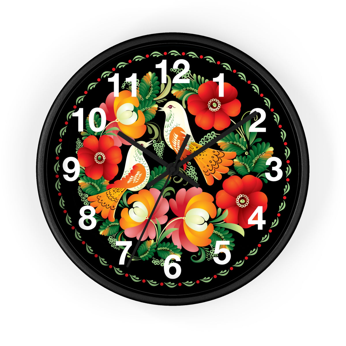 The Folk Art Love Birds Wall Clock features a round black frame and face, adorned with colorful folk art flowers and two white birds at the center. White numbers and black hands add charm to this whimsical wall decor for any room.
