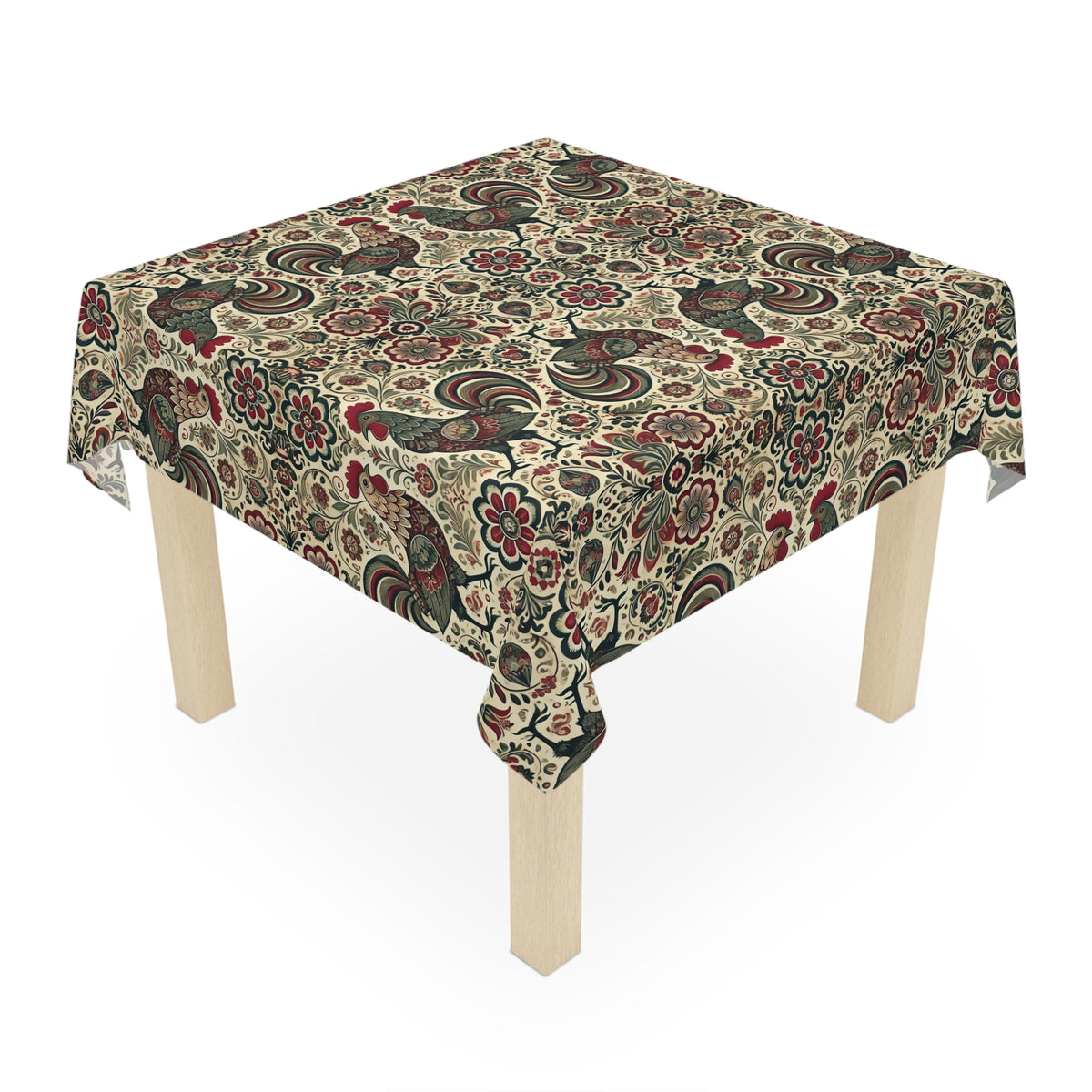 A square wooden table adorned with the Farmhouse Rooster Tablecloth in white, featuring decorative floral and paisley patterns—ideal for adding elegant charm to your dining decor.