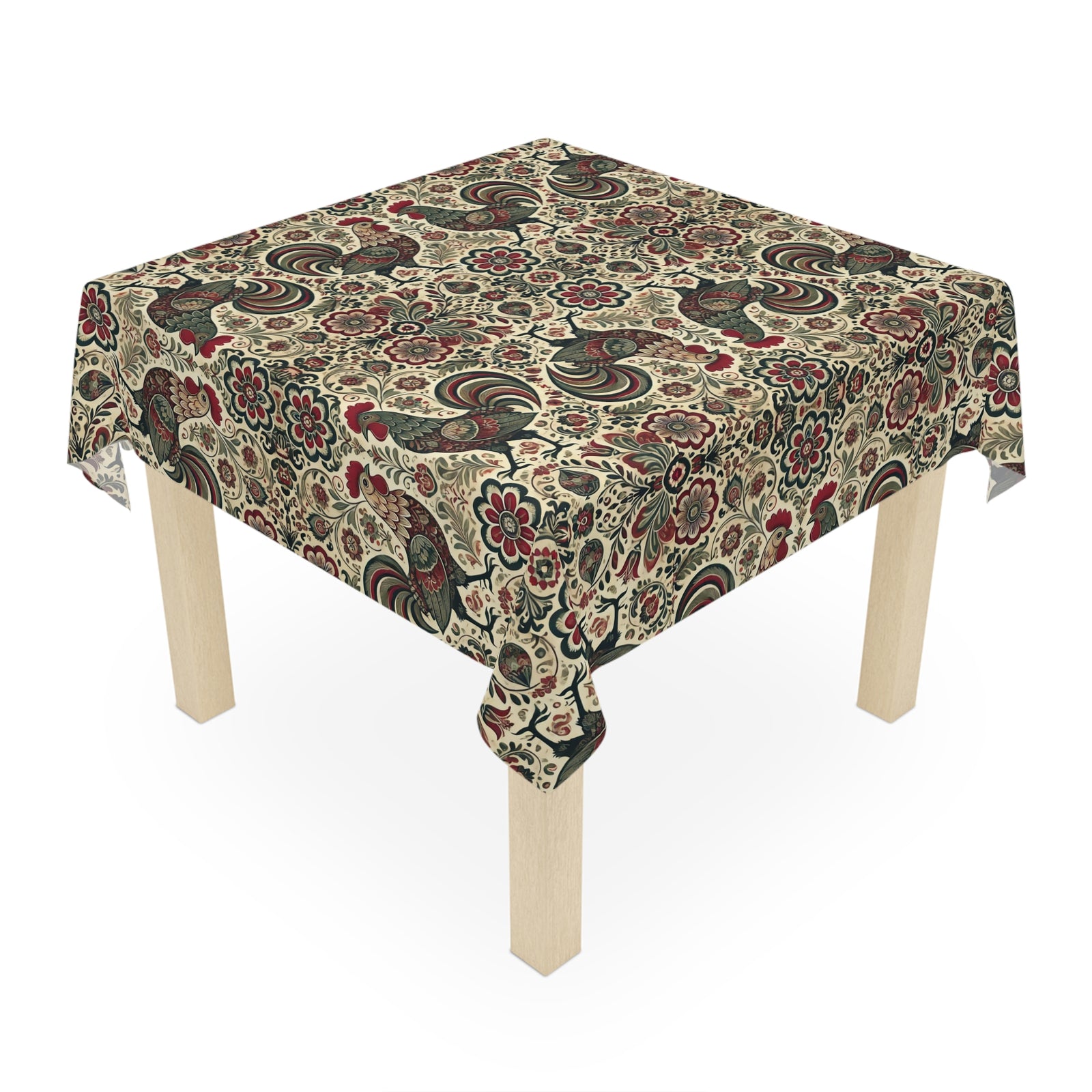 A square wooden table adorned with the Farmhouse Rooster Tablecloth in white, featuring decorative floral and paisley patterns—ideal for adding elegant charm to your dining decor.