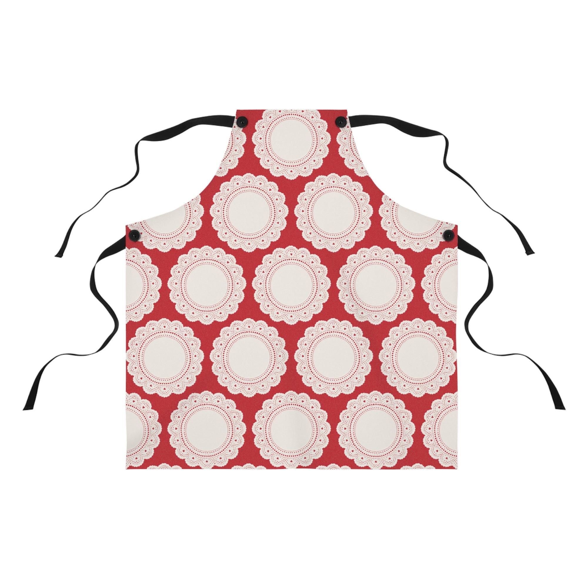 The Lace Doily Pattern Poly Twill Apron is red, showcasing a repeating white doily motif with scalloped edges and black adjustable neck and waist ties.