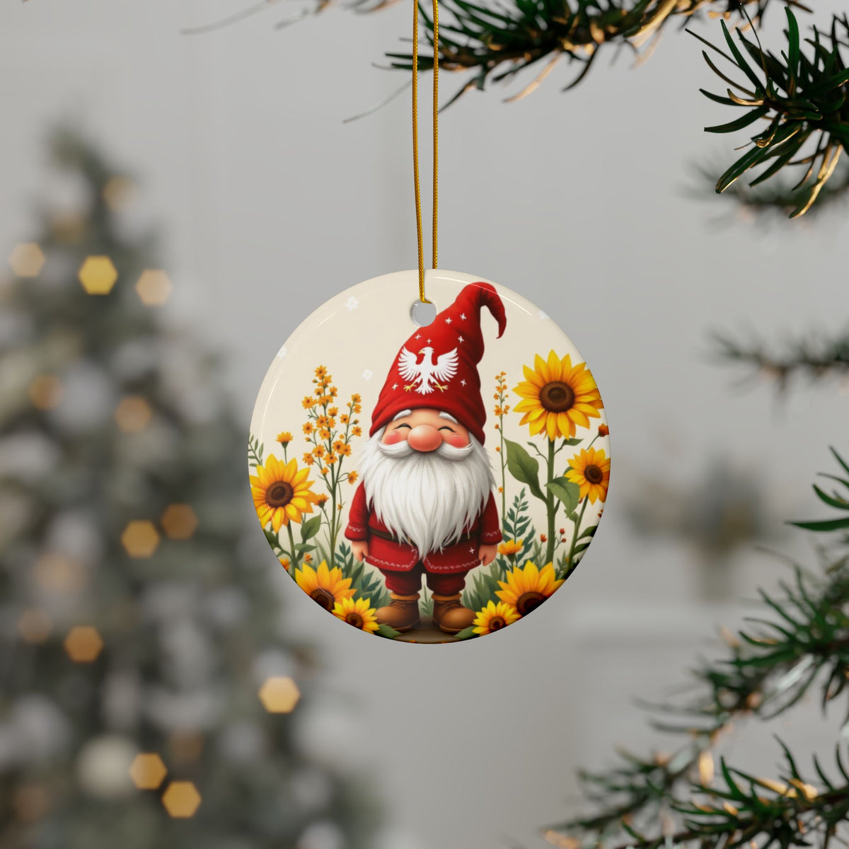 The Polish Gnome Smiling Ceramic Ornaments feature a cheerful red-hatted gnome among sunflowers, hanging from a Christmas tree. This charming keepsake adds festive cheer, with a decorated holiday tree softly glowing in the background.