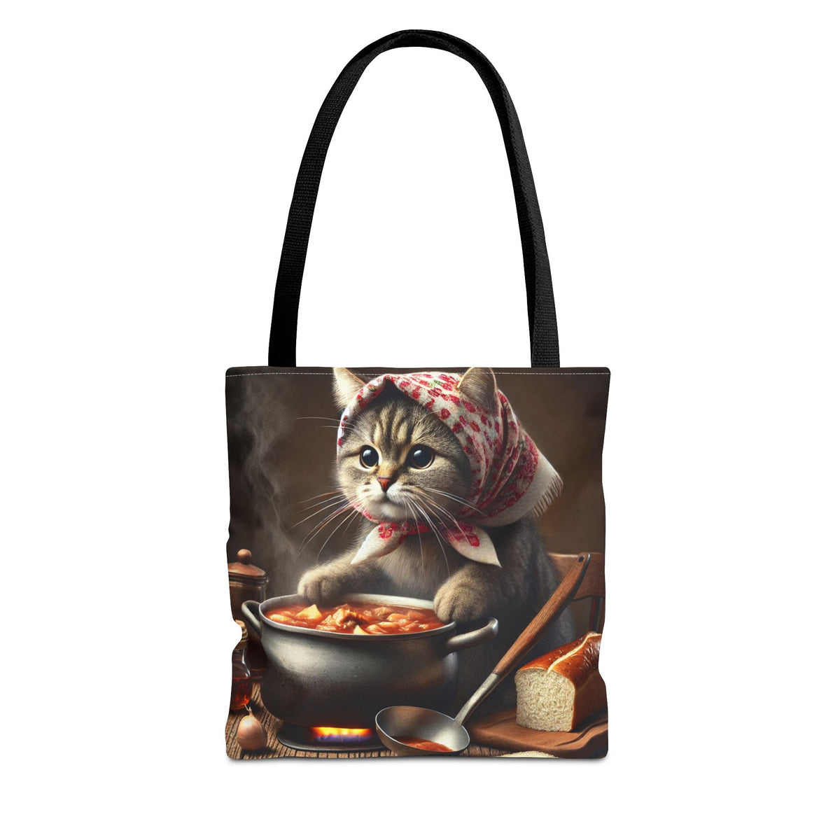 The Cute Polish Cat Cooking Bigos Tote Bag in black features a cozy kitchen scene with a kitten in a scarf stirring soup, surrounded by bread, a spoon, and veggies—perfect for animal lovers.