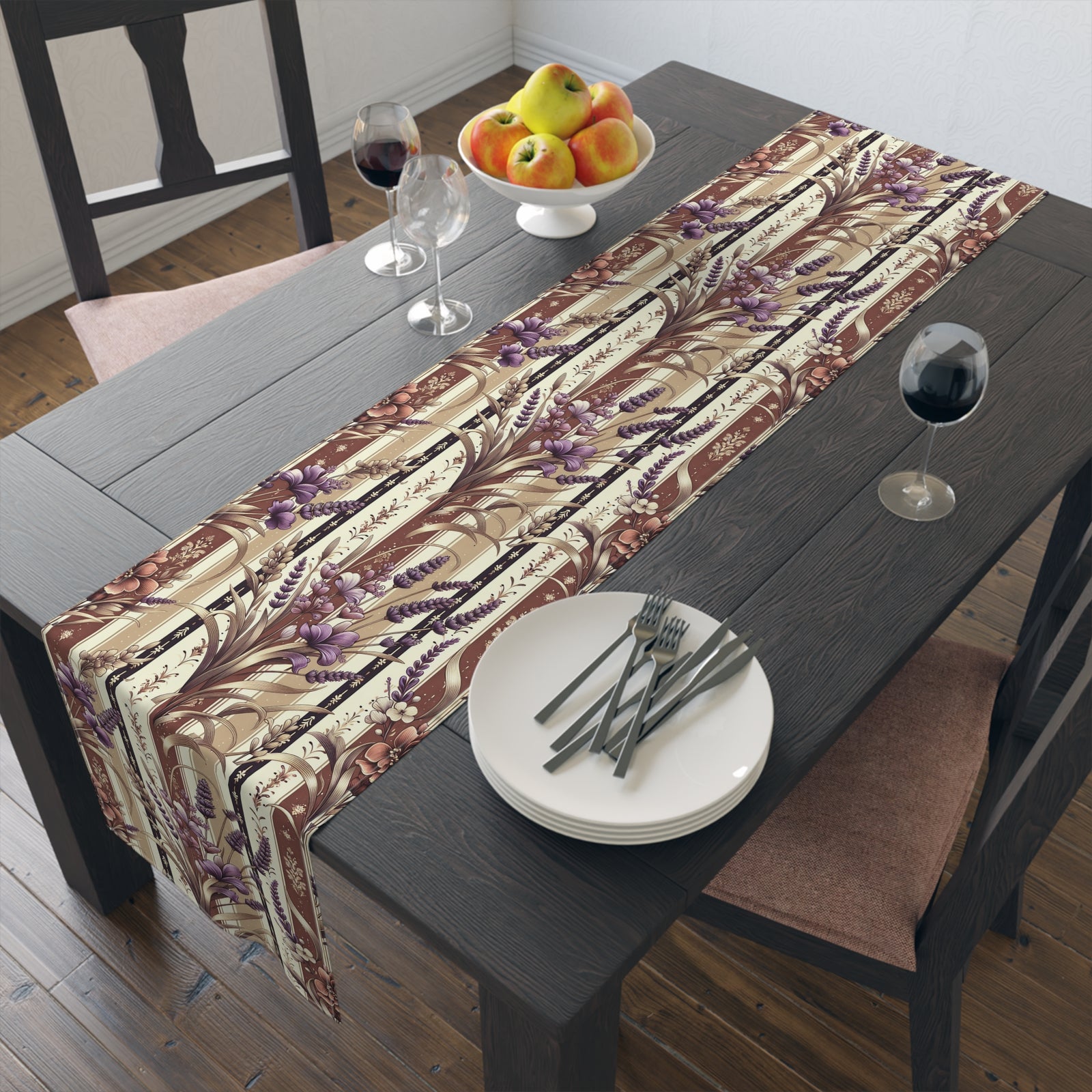 A dark wood dining table set for two with white plates, cutlery, wine glasses, and fruit is enhanced by the Elegant Floral Table Runner in beige, purple, and brown tones for stylish dining table decor.