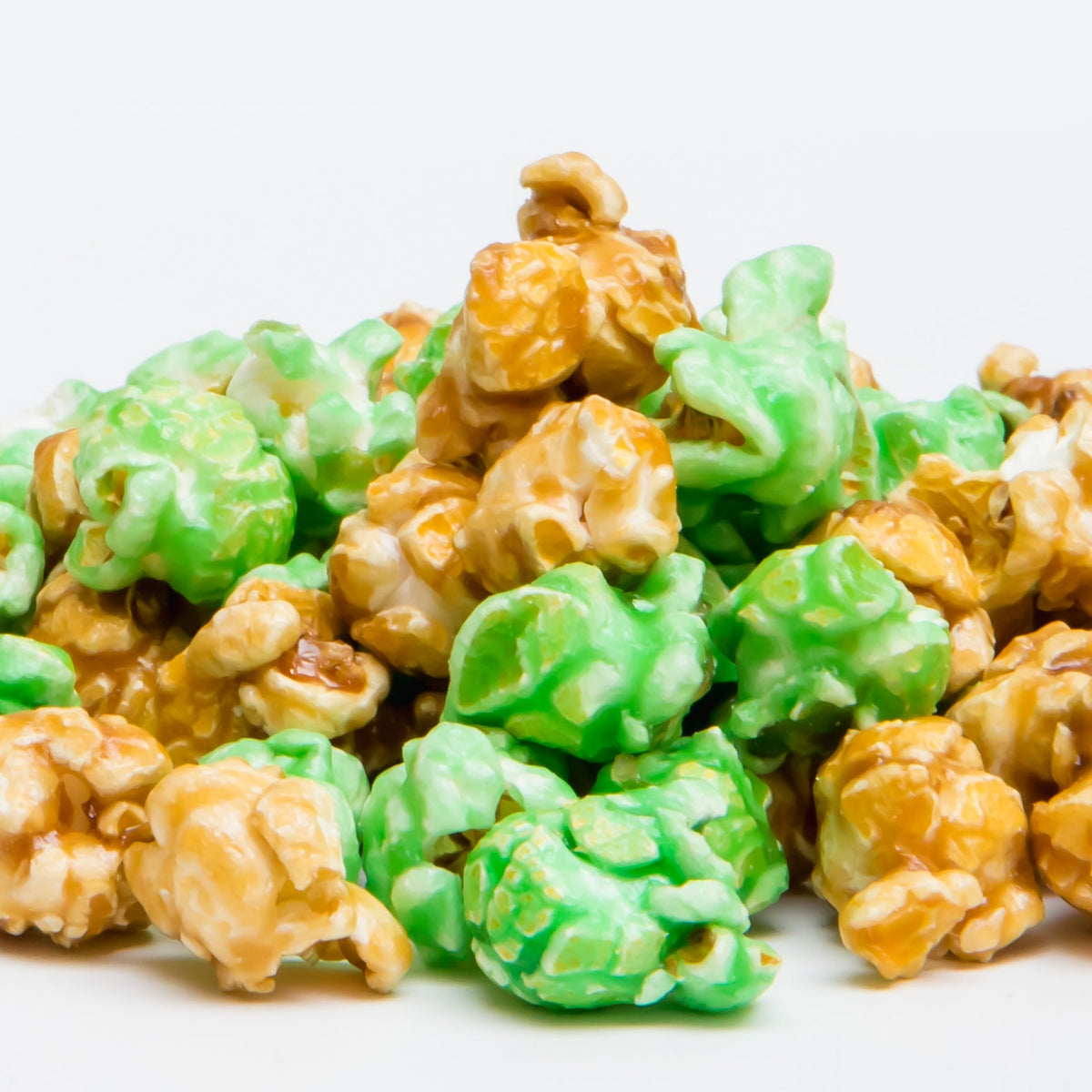 A pile of Caramel Apple Popcorn sits against a plain white background.