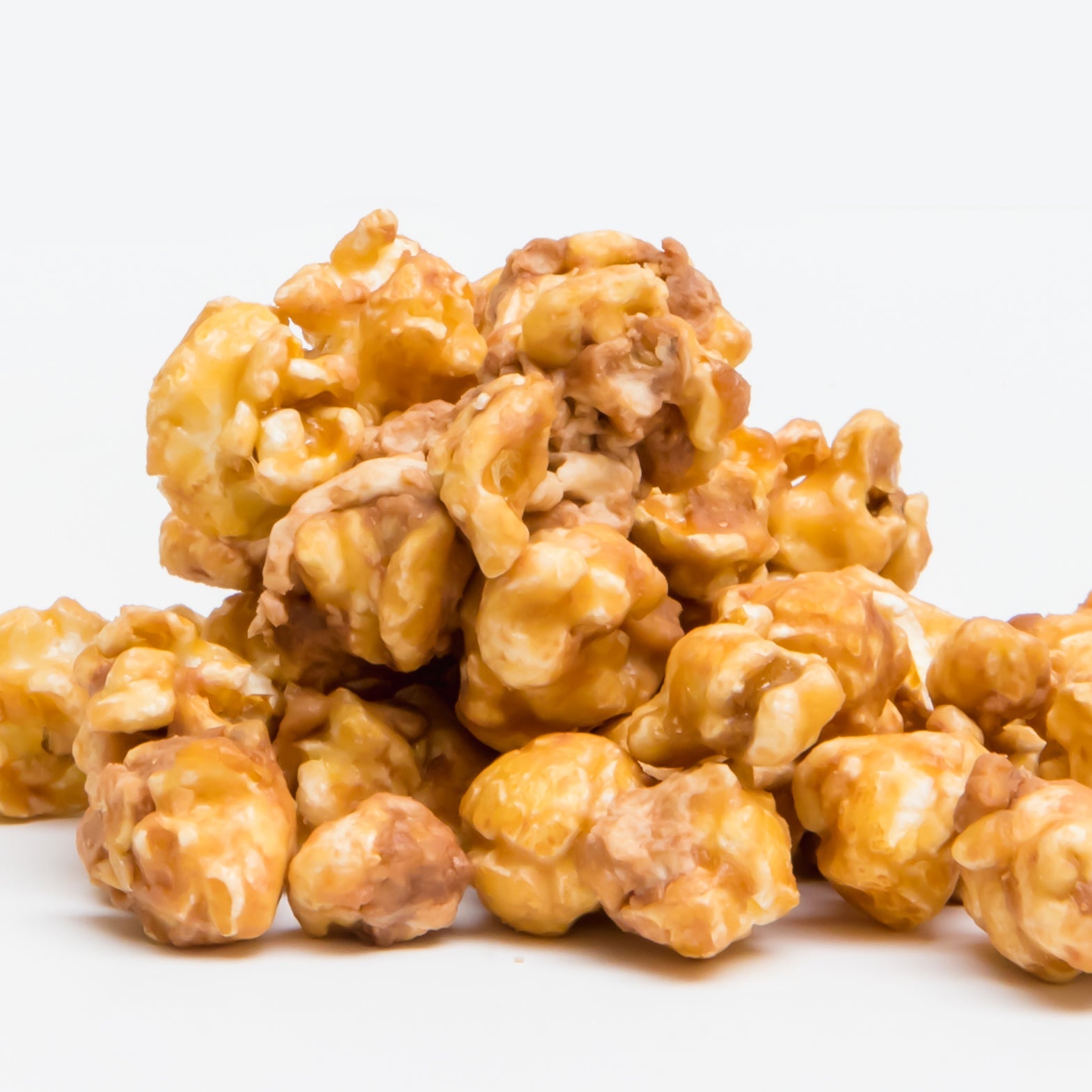 Snickers Caramel Popcorn, featuring caramel-coated popcorn pieces inspired by Snickers candy, is shown on a plain white background.