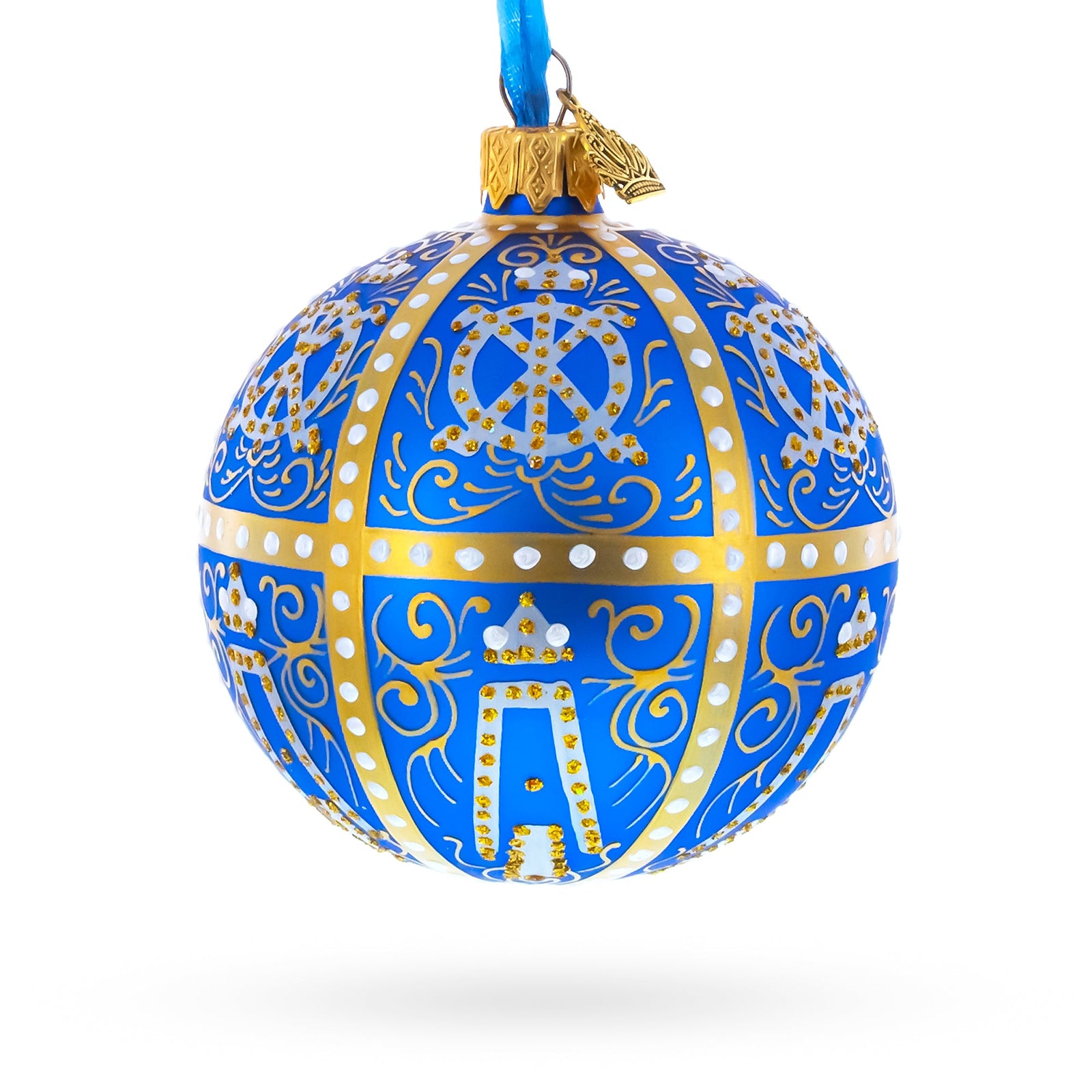 The 1896 Twelve Monograms Royal Blue Glass Ball Christmas Ornament (3.25") is a hand-painted German ornament with gold and white designs, a blue ribbon, and gold cap—an elegant choice for your luxury holiday decor.