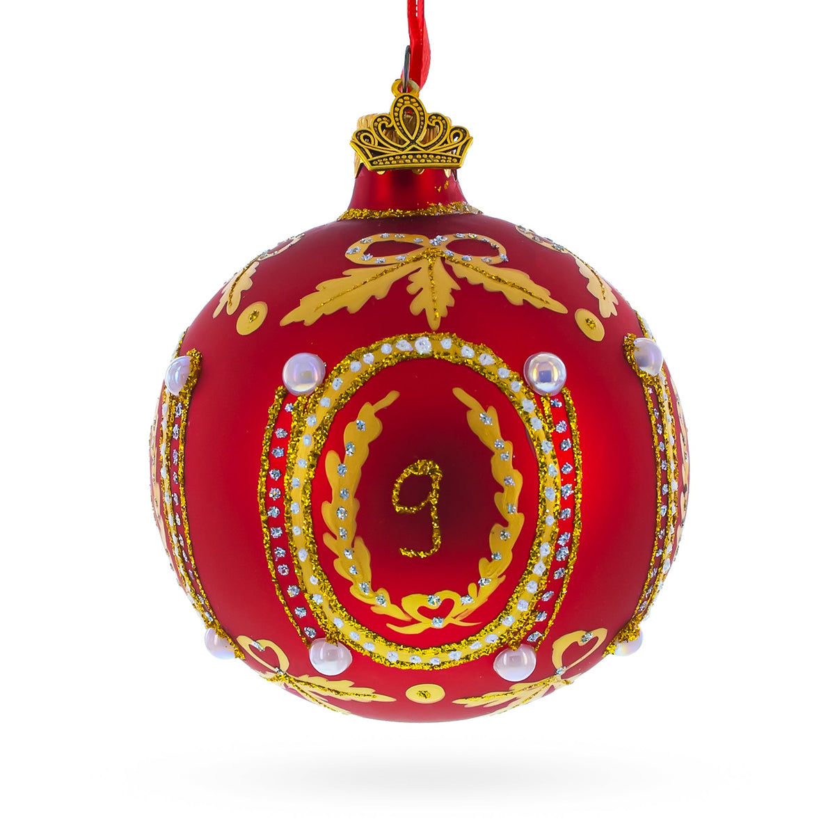 The 1893 Caucasus Royal Red Glass Ball Christmas Ornament (3.25&quot;) features gold patterns, white pearls, a crown-shaped top, and the number 9 in gold at its center with ornate details and rhinestones.
