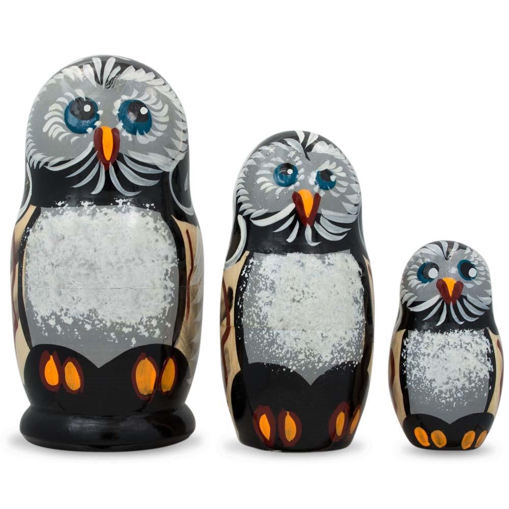 Set of 3 Owl Family Wooden Nesting Dolls, each 4.25 inches tall, feature blue eyes, white faces, and orange feet—arranged from largest to smallest for charming owl décor or unique gifts.
