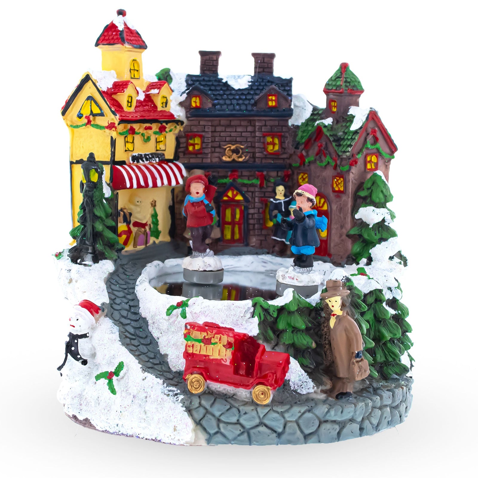 The Winter Village Skating Animated Musical Christmas Figurine features colorful houses, snow-covered trees, winter-dressed figures, a red truck, and a frozen pond—perfect for creating a cheerful holiday display by your Christmas music box.