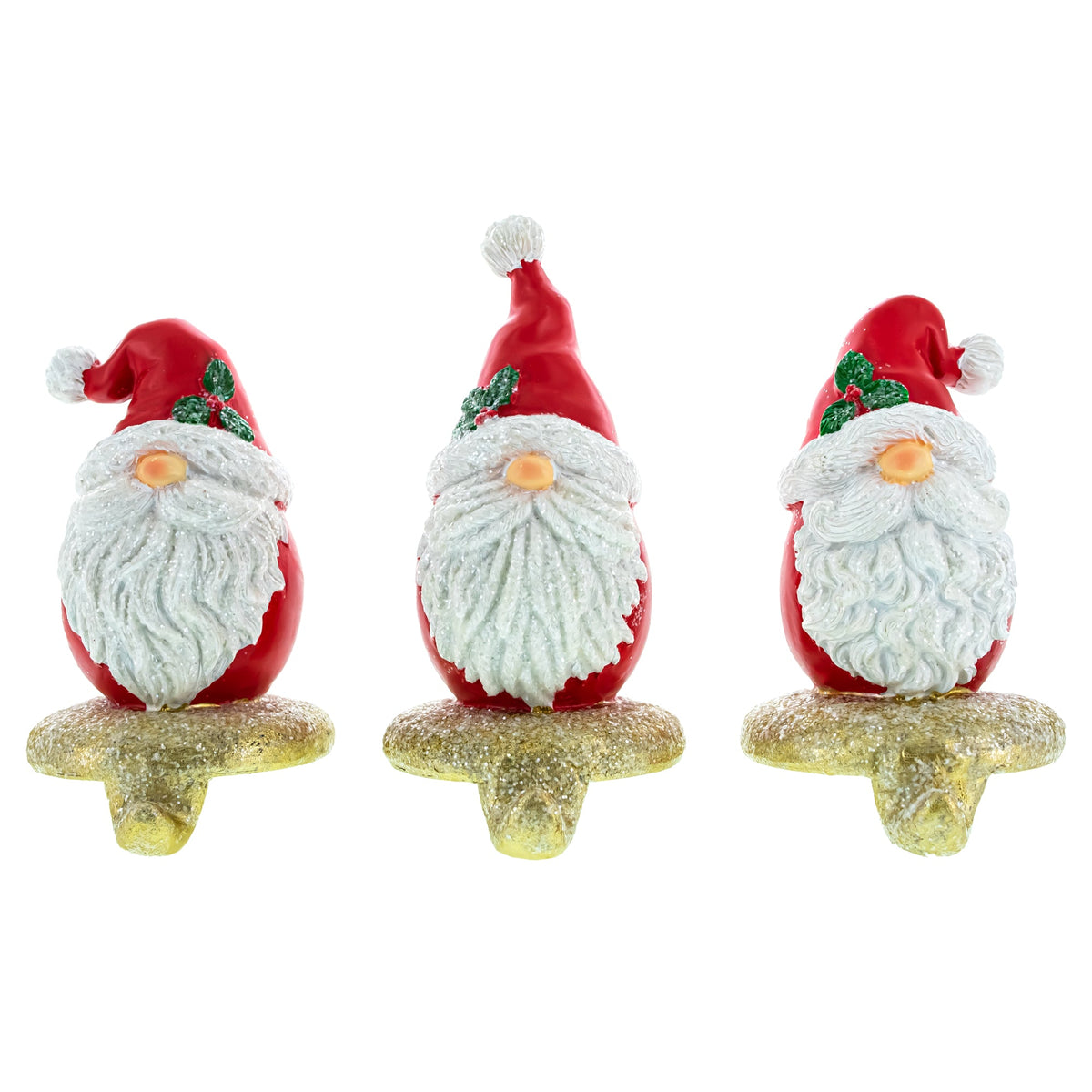 The Set of 3 Santa Gnome Stocking Holders Hangers feature hand-painted Santas with white beards, red hats, and green holly on gold glitter bases—perfect festive Christmas mantel decor for charming holiday stocking displays.